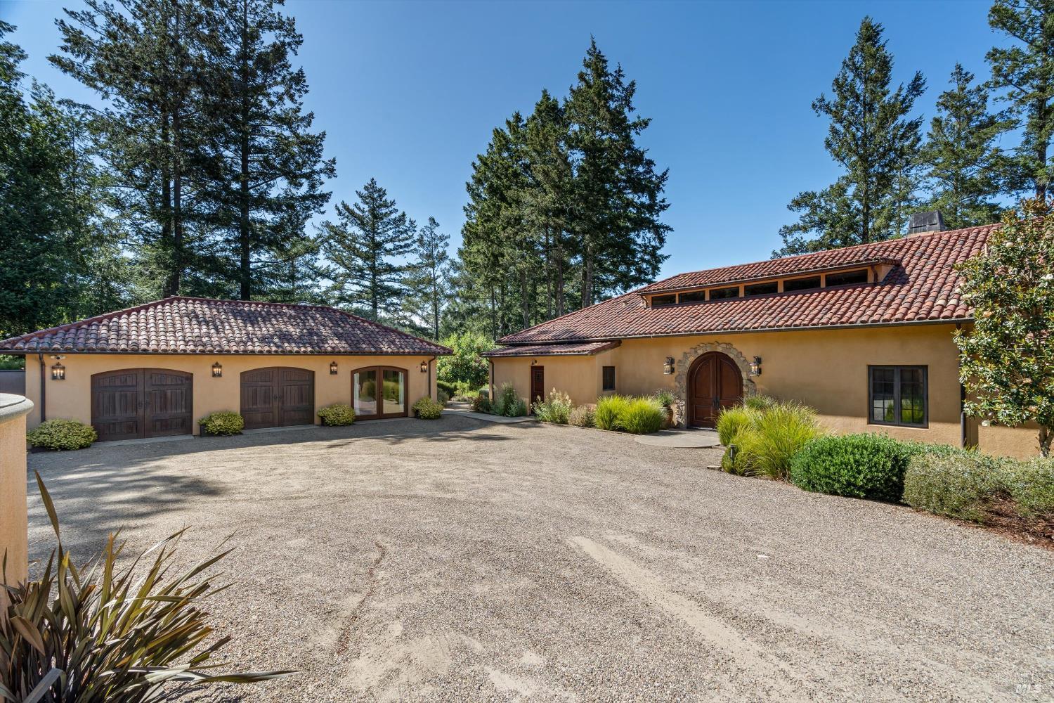 1315 West Dry Creek Road Healdsburg, CA 95448 - Photo 50 of 57 a front view of a house with yard and trees