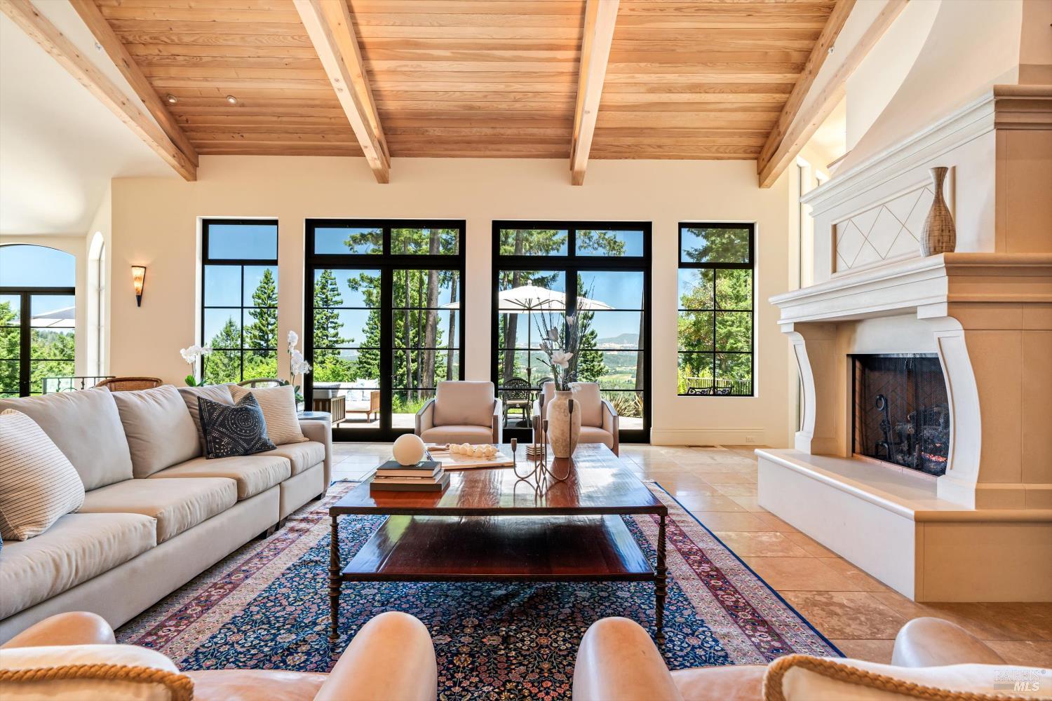 1315 West Dry Creek Road Healdsburg, CA 95448 - Photo 6 of 57 a living room with furniture fireplace and a large window