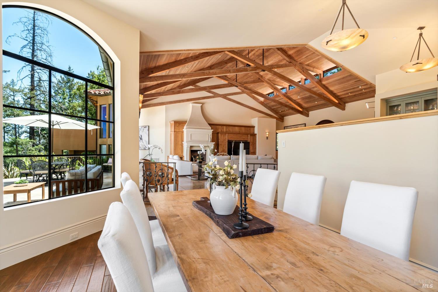 1315 West Dry Creek Road Healdsburg, CA 95448 - Photo 8 of 57 a view of a dining room with furniture wooden floor and a chandelier