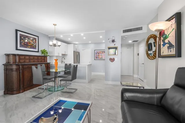 a kitchen with stainless steel appliances a refrigerator sink and microwave