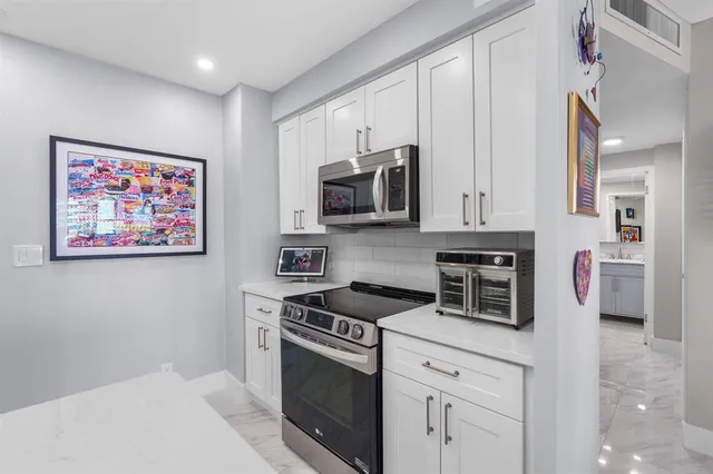 a bathroom with a toilet sink and shower