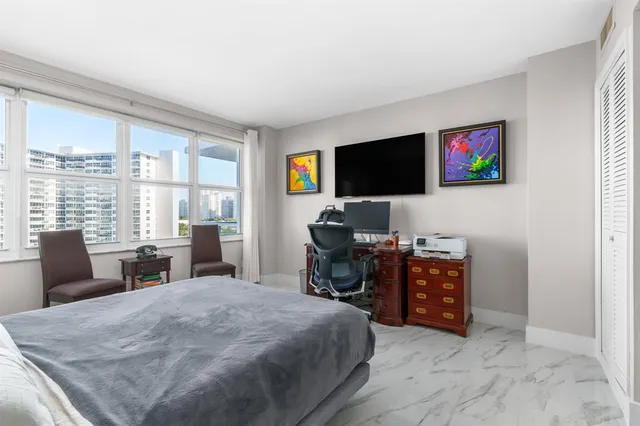 a bedroom with a bed and furniture