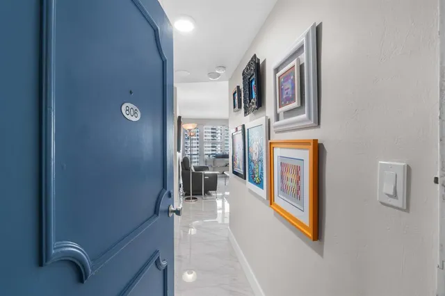 a view of a livingroom with furniture and workspace