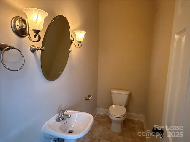 a bathroom with a toilet and a sink