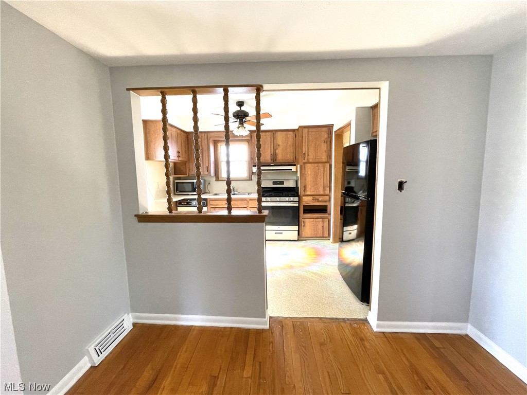 1580 Brainard Road Lyndhurst, OH 44124 - Photo 2 of 20 Dining area into kitchen. GE range is gas, newer refrigerator