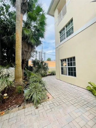 a view of a backyard of the house