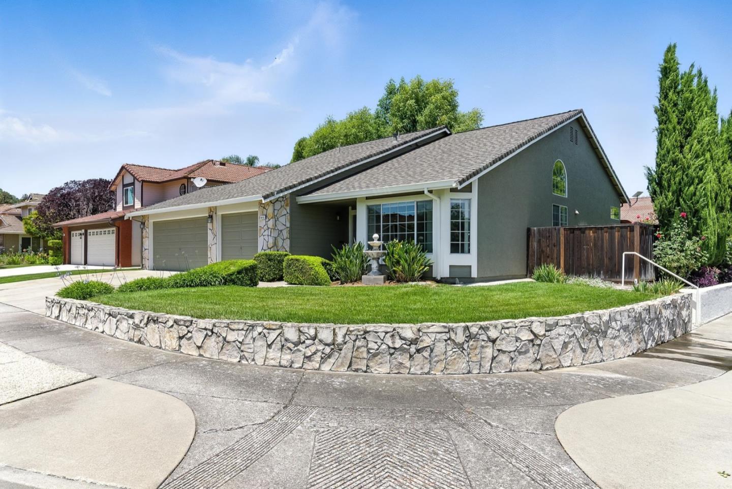 1415 Quail Walk Drive Gilroy, CA 95020 - Photo 1 of 29 a front view of a house with a garden and plants