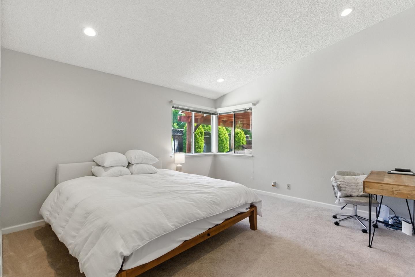 1415 Quail Walk Drive Gilroy, CA 95020 - Photo 11 of 29 a bedroom with a bed a table and a window