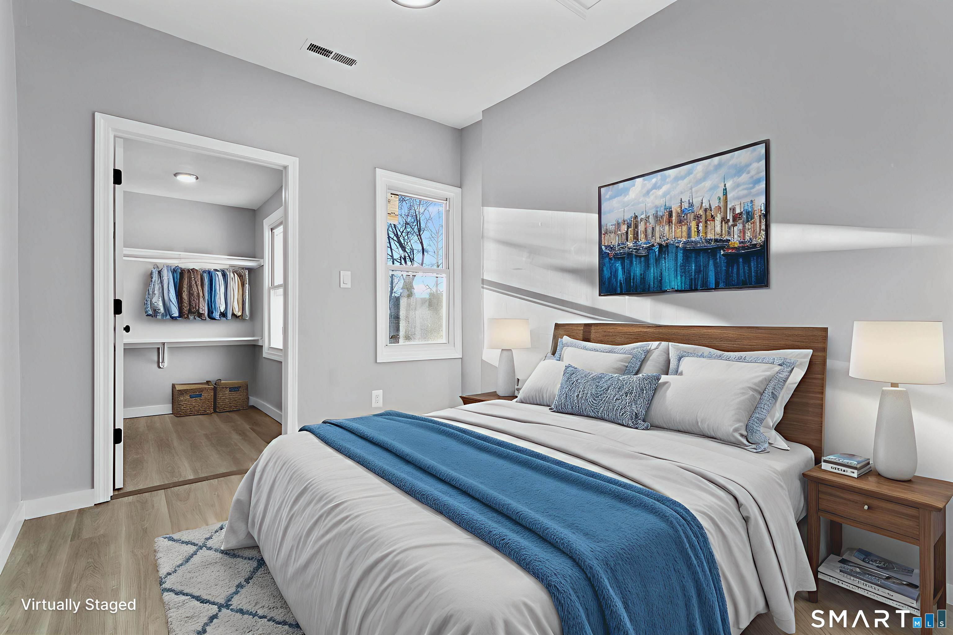 257 North State Street Ansonia, CT 06401 - Photo 16 of 36 a bedroom with a bed and a painting on the wall