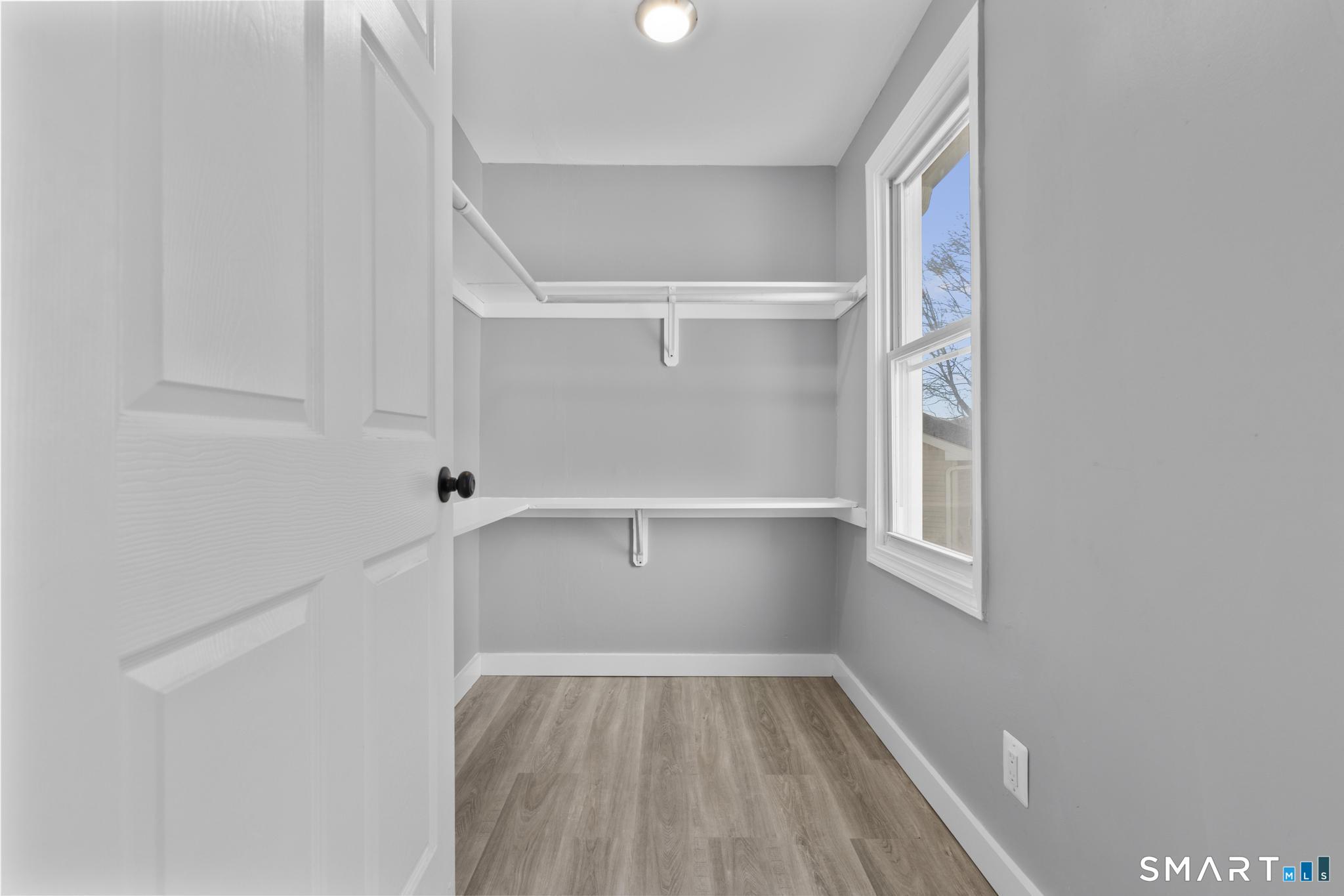 257 North State Street Ansonia, CT 06401 - Photo 19 of 36 a view of walk in closet with empty racks