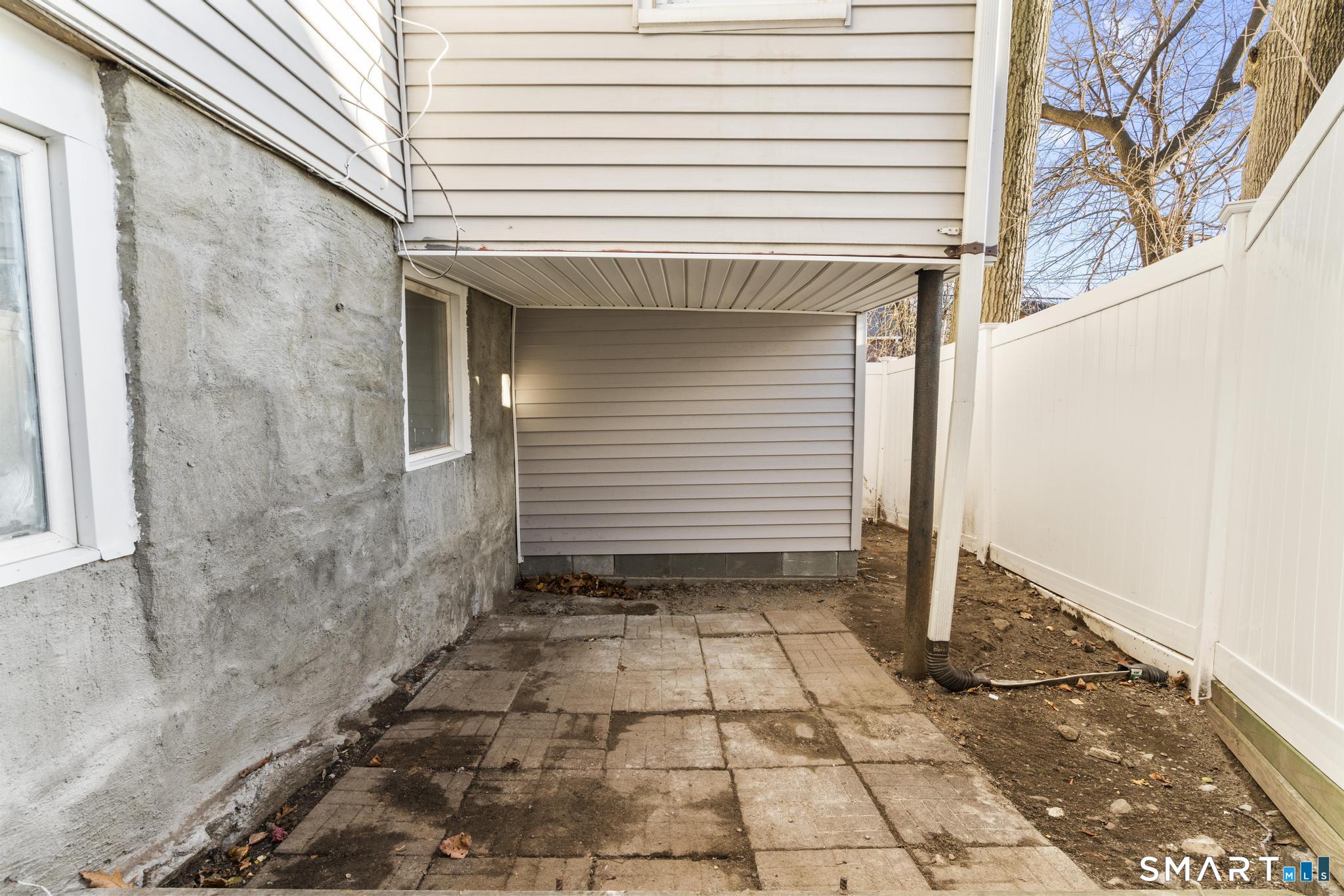 257 North State Street Ansonia, CT 06401 - Photo 30 of 36 a view of a backyard with a door