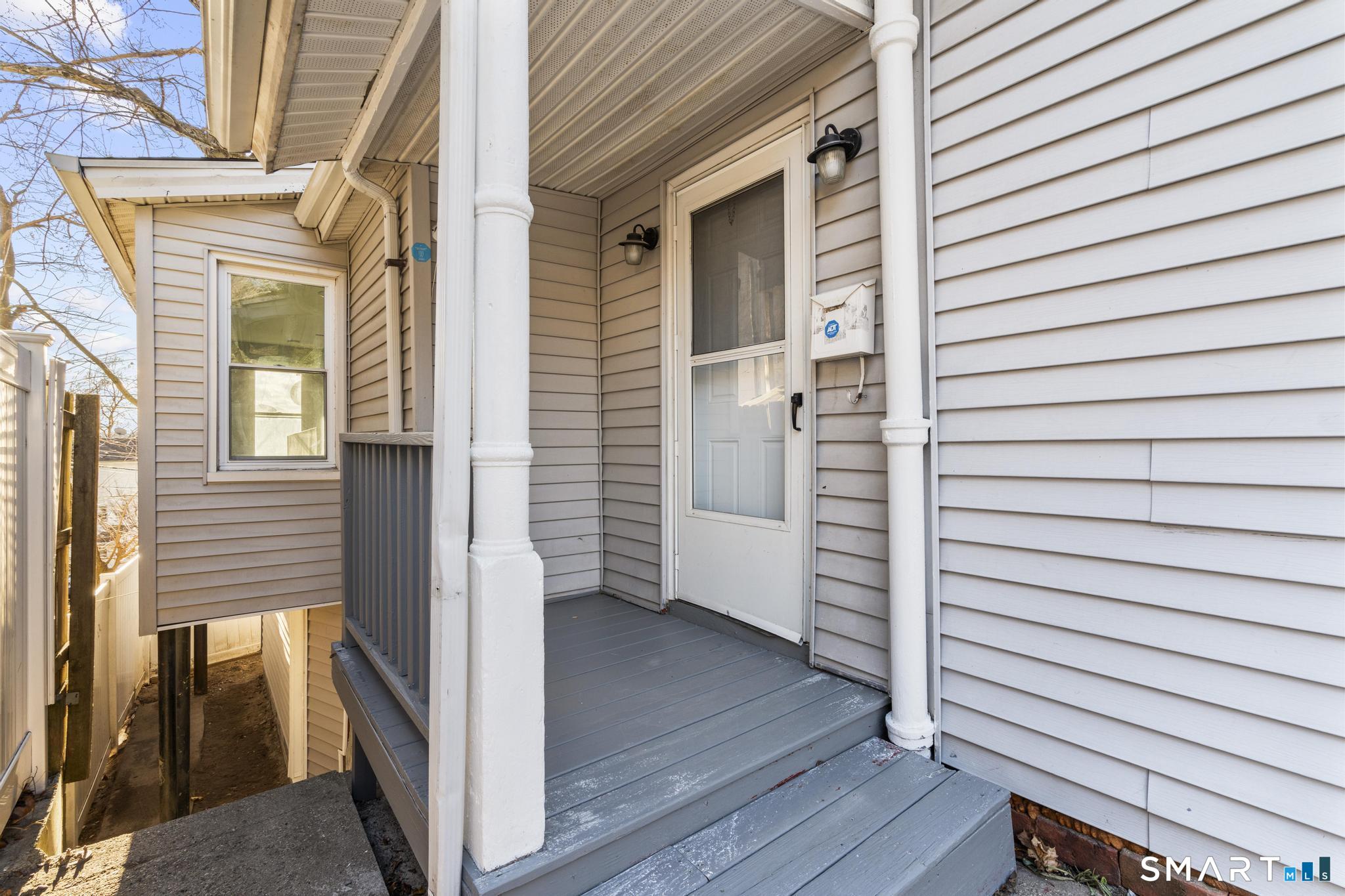 257 North State Street Ansonia, CT 06401 - Photo 4 of 36 a view of a porch with wooden floor and stairs