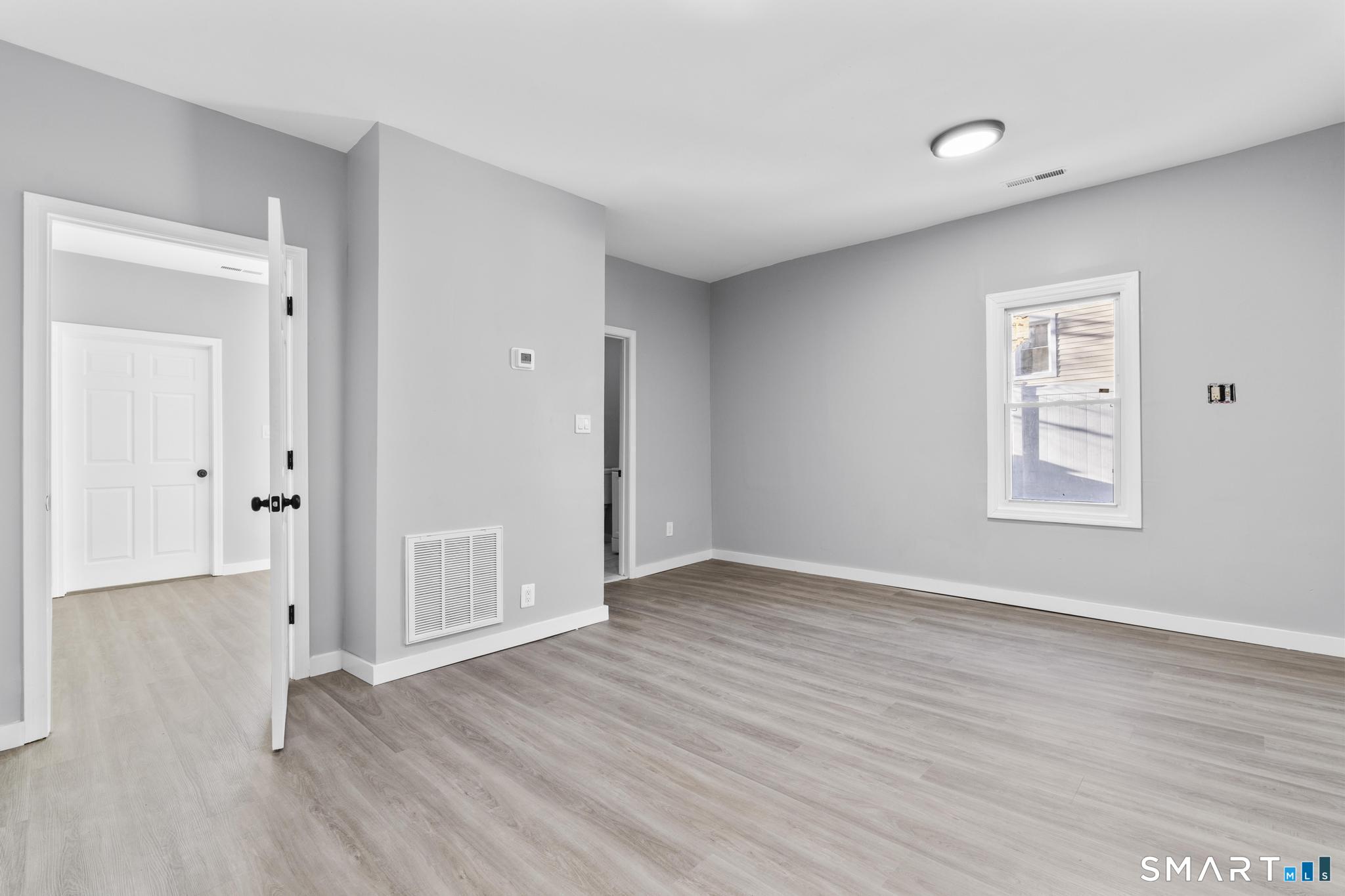 257 North State Street Ansonia, CT 06401 - Photo 9 of 36 a view of an empty room with wooden floor