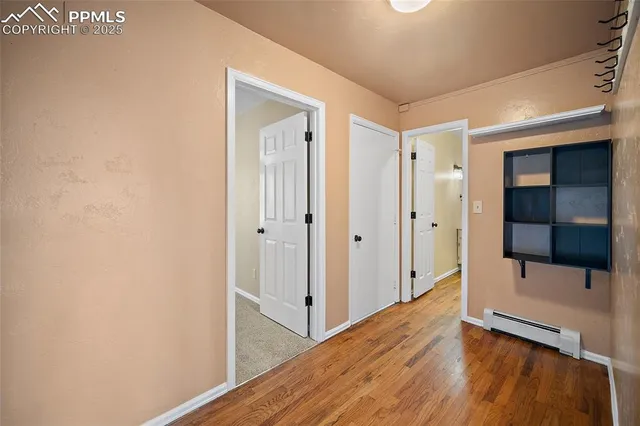 an empty room with windows and closet