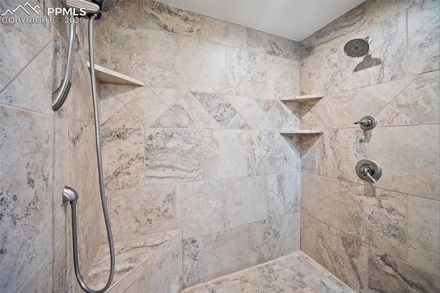 a view of room with window and ceiling fan