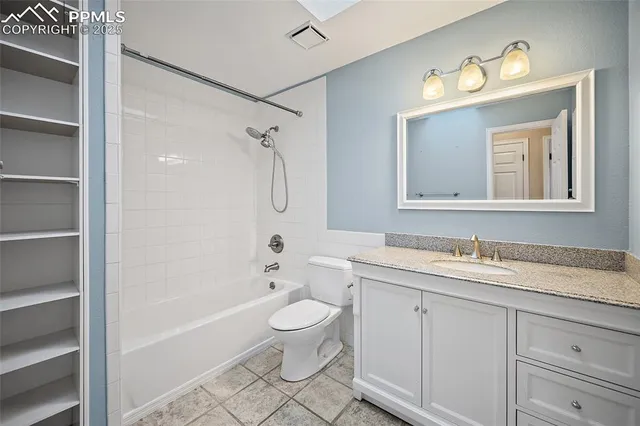 a room with pool table and windows