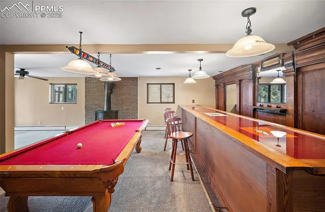 a view of a livingroom with furniture and a ceiling fan
