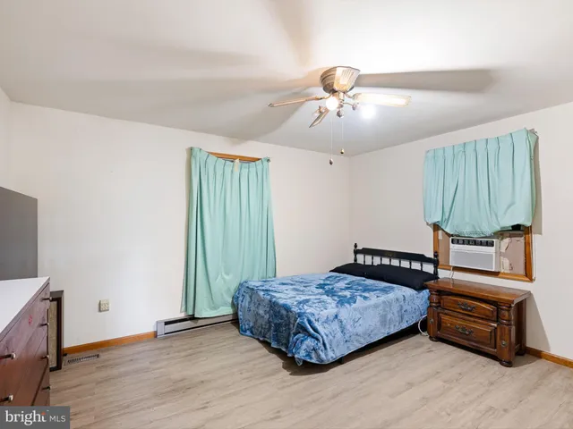 a kitchen with stainless steel appliances a stove a sink and a refrigerator