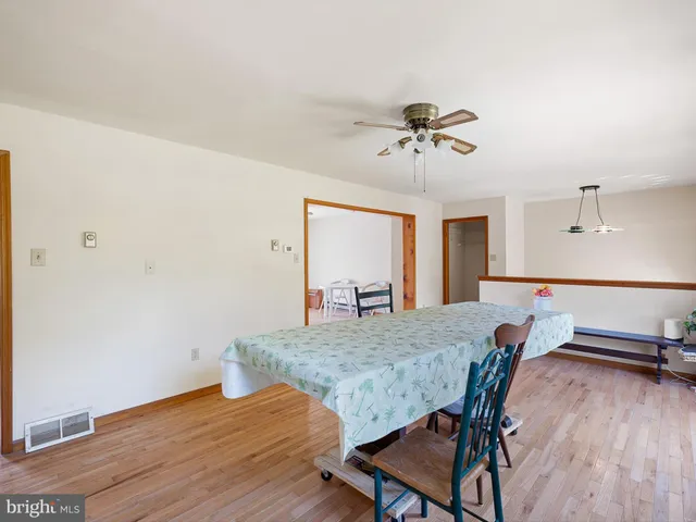 a view of a livingroom with furniture window and wooden floor