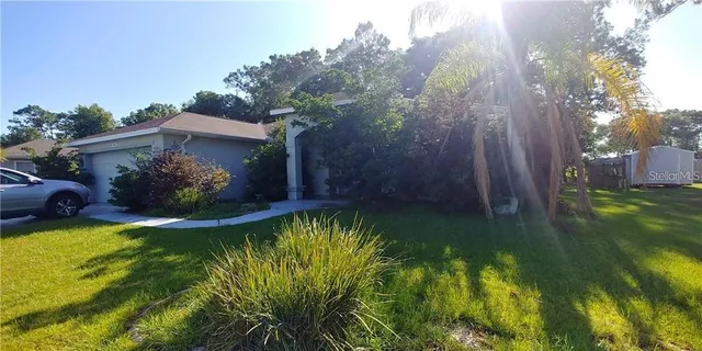a view of a swimming pool with a garden