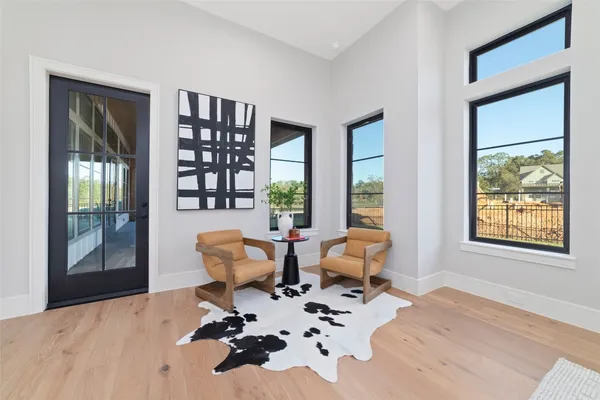 a living room filled with furniture and a potted plant