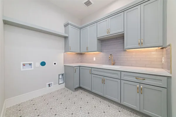a kitchen with cabinets and white appliances