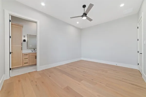 a view of a room with a bed and cabinets