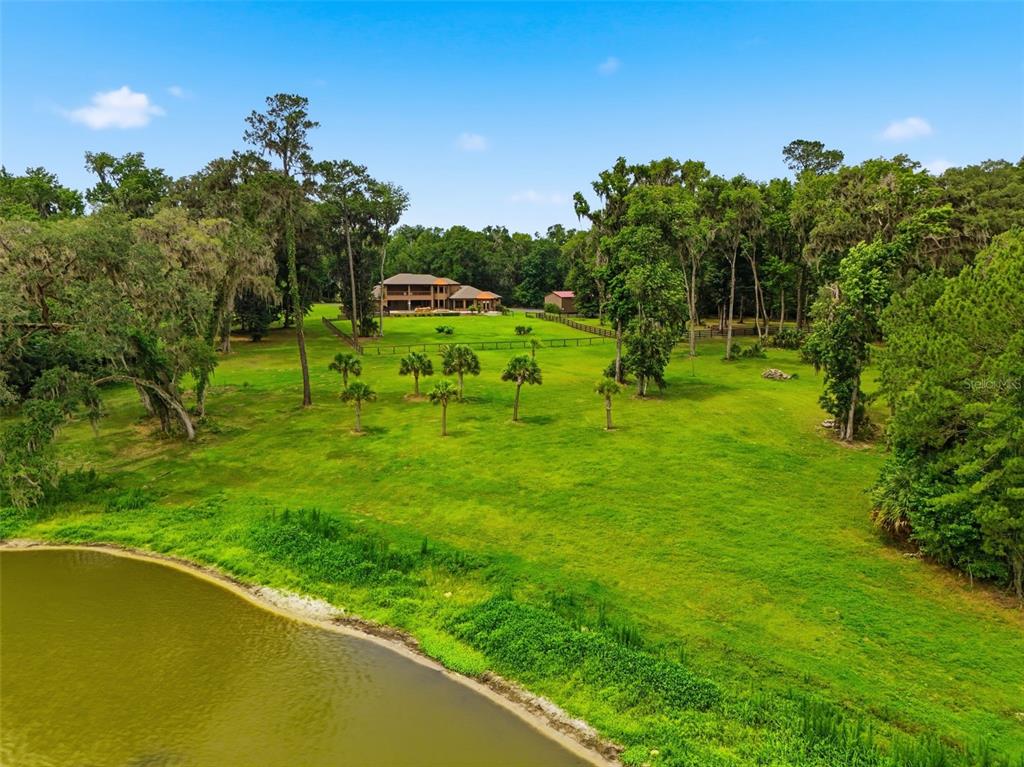 855 Southeast 87th Street Ocala, FL 34480 - Photo 78 of 79 a view of a garden with a swimming pool