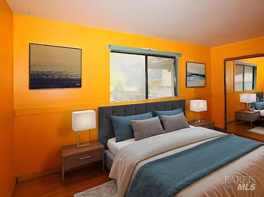 a view of a balcony with wooden floor