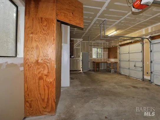 a view of an empty room with wooden walls