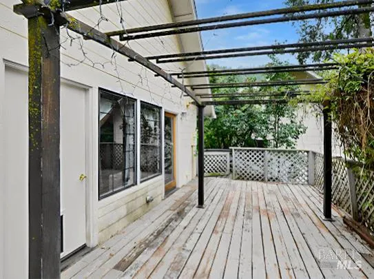a view of balcony with furniture and garden