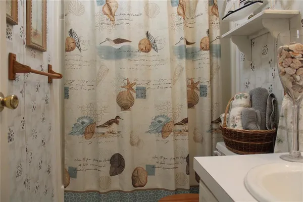 a bathroom with a sink and toilet