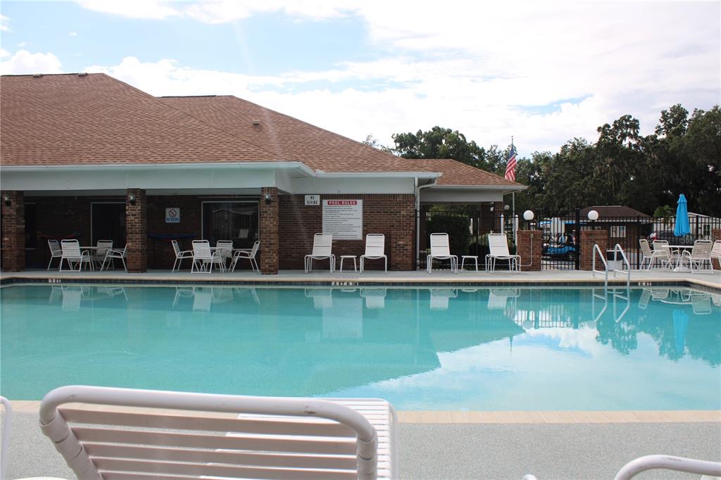 8314 Nancy Lane Ellenton, FL 34222 - Photo 27 of 34 a view of a lake with a house swimming pool and outdoor seating
