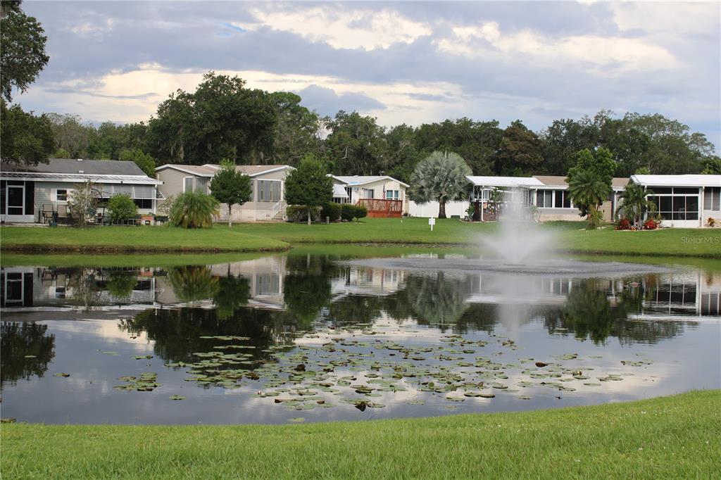 8314 Nancy Lane Ellenton, FL 34222 - Photo 33 of 34 a front view of a house with a yard