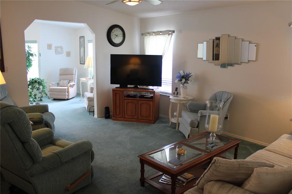 8314 Nancy Lane Ellenton, FL 34222 - Photo 7 of 34 a living room with furniture and a flat screen tv