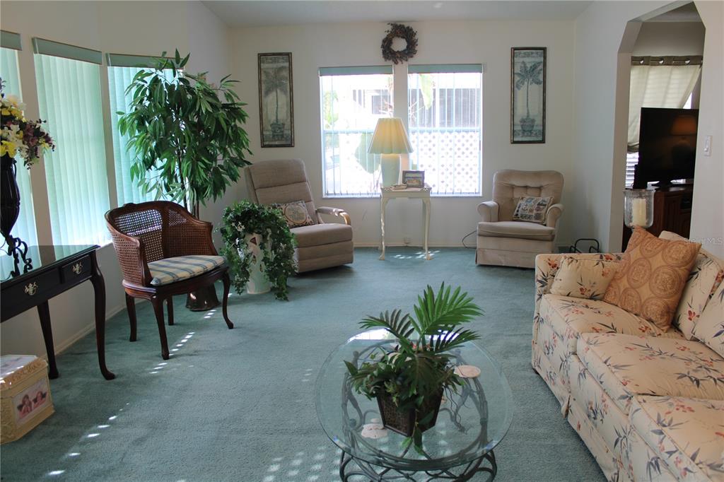 8314 Nancy Lane Ellenton, FL 34222 - Photo 9 of 34 a living room with furniture and a potted plant