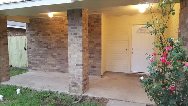 a view of door with a potted plant in front of door