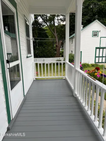 a view of balcony with small garden
