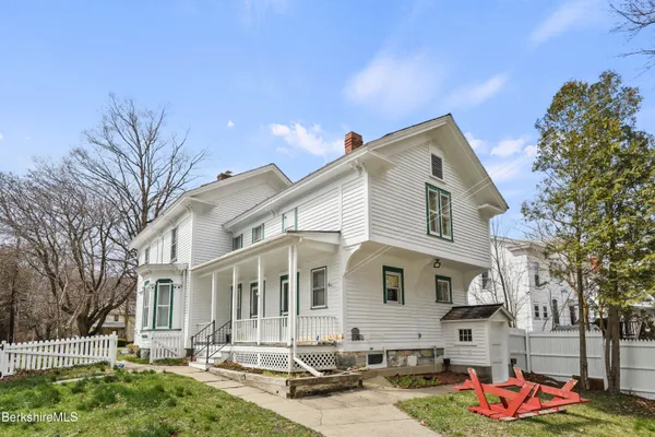 a front view of a house with yard