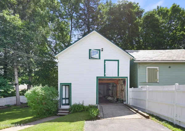 a view of house with yard and entertaining space