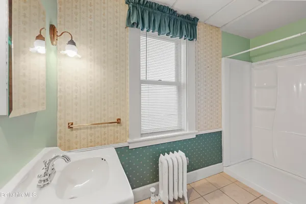 a bathroom with a bathtub and a sink