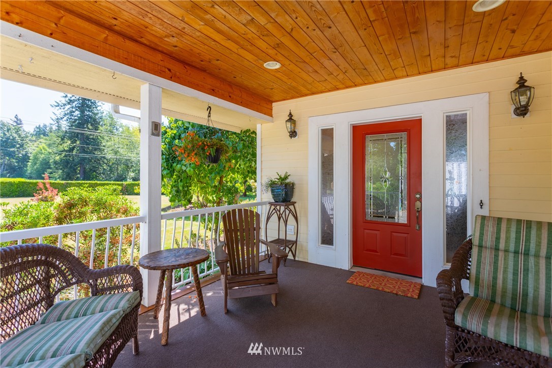 8949 Delta Line Road Custer, WA 98240 - Photo 2 of 39 a balcony with chairs and a table