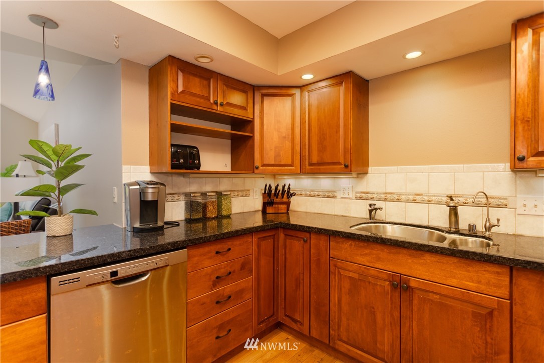 8949 Delta Line Road Custer, WA 98240 - Photo 11 of 39 a kitchen with stainless steel appliances a sink a counter space and cabinets