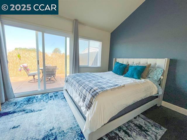 232 O'Neil Circle Hercules, CA 94547 - Photo 9 of 12 a bedroom with a bed and glass door