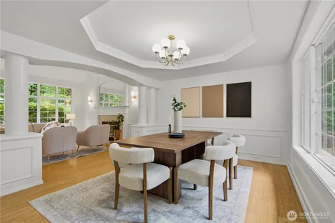 a view of a dining room with furniture window and wooden floor