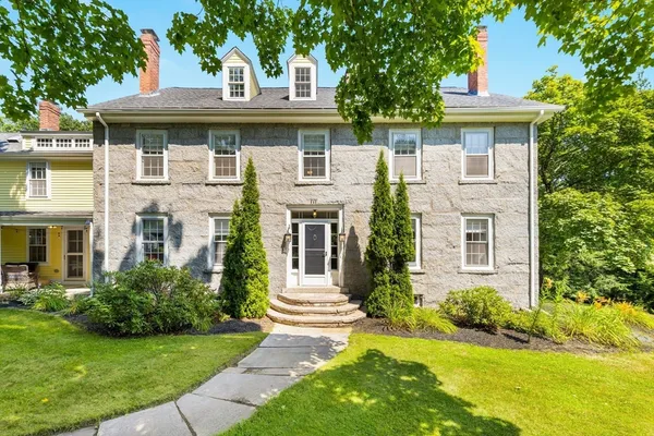 a front view of a house with a yard