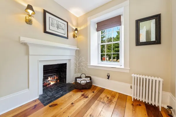a bedroom with a bed and a fireplace