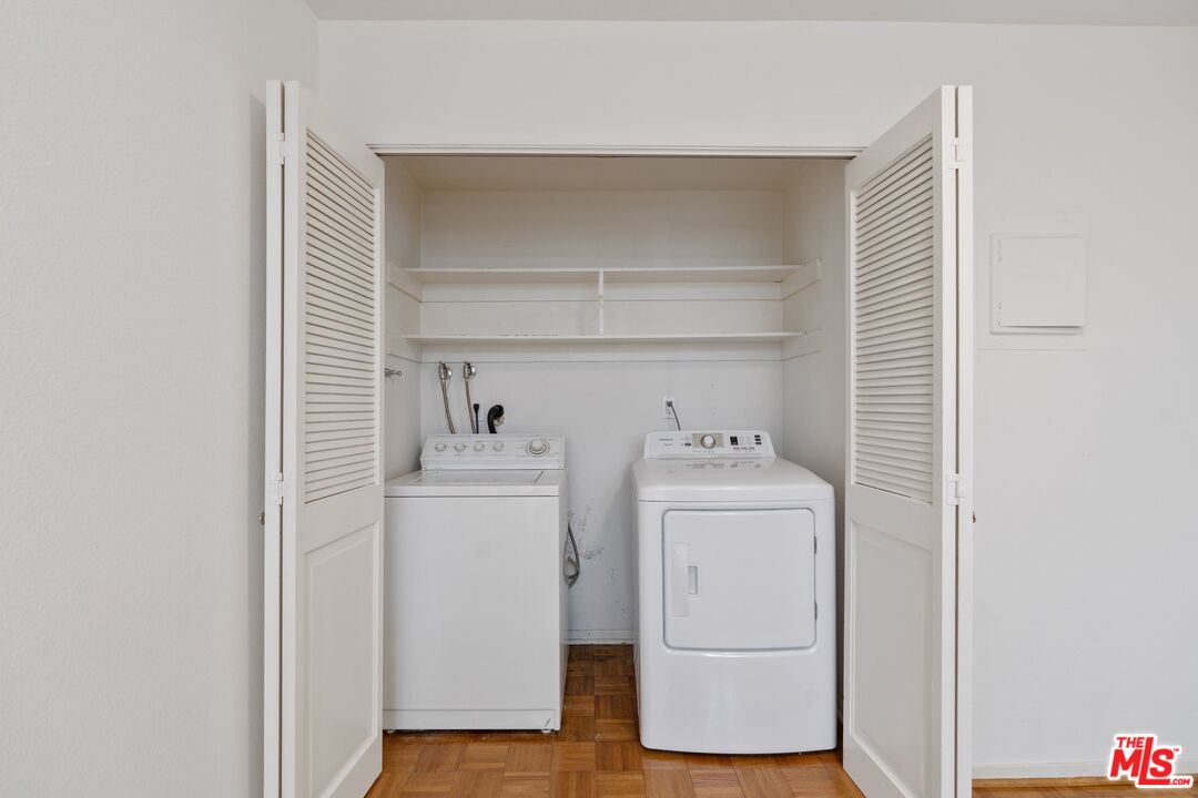 11687 Bellagio Road, Unit 5 Los Angeles, CA 90049 - Photo 14 of 31 a utility room with dryer and washer