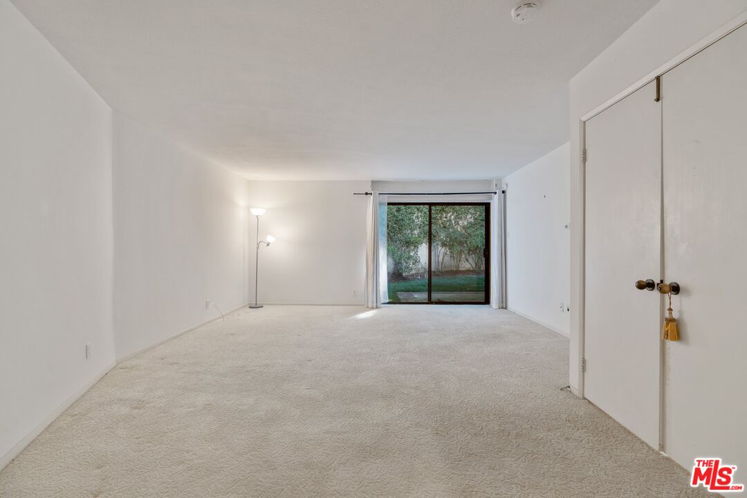 11687 Bellagio Road, Unit 5 Los Angeles, CA 90049 - Photo 17 of 31 a view of an empty room with a window