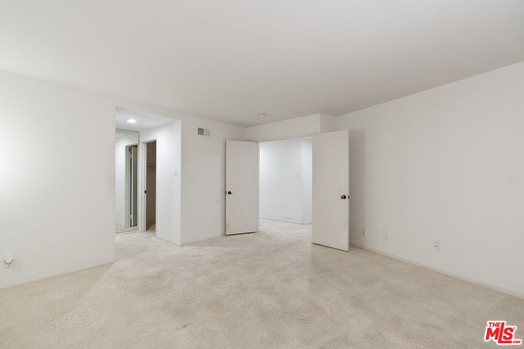 11687 Bellagio Road, Unit 5 Los Angeles, CA 90049 - Photo 23 of 31 a view of an empty room
